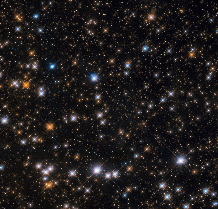 In imagine: o parte din roiul stelar Messier 11. Fiecare punct luminos este o... stea. Foto: ESA/Hubble & NASA, P. Dobbie et al.